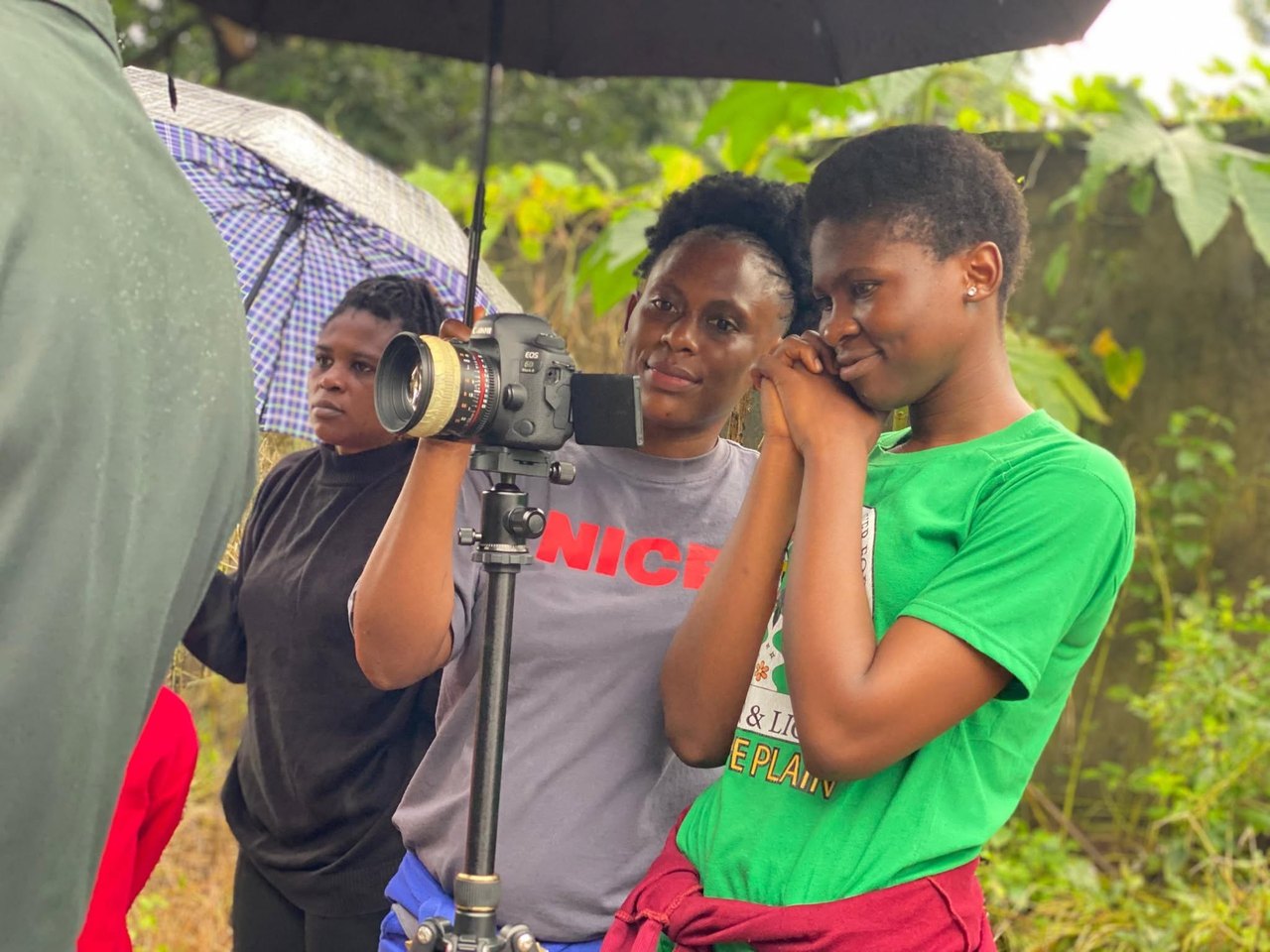 A group of emerging filmmakers working together outdoors.