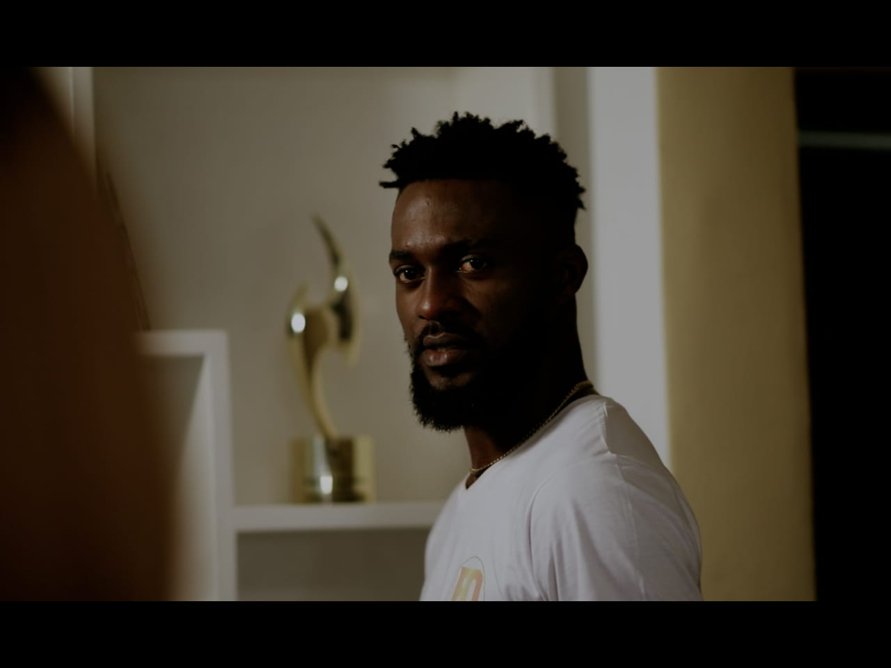 A trailer still from Just a Minute.