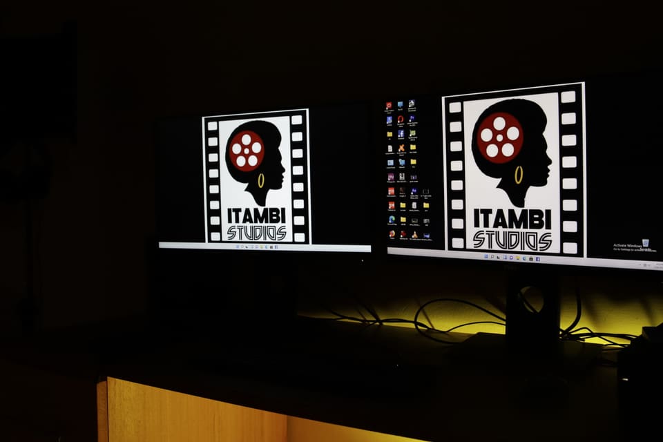 Itambi Studios logo artwork displayed on studio monitors.