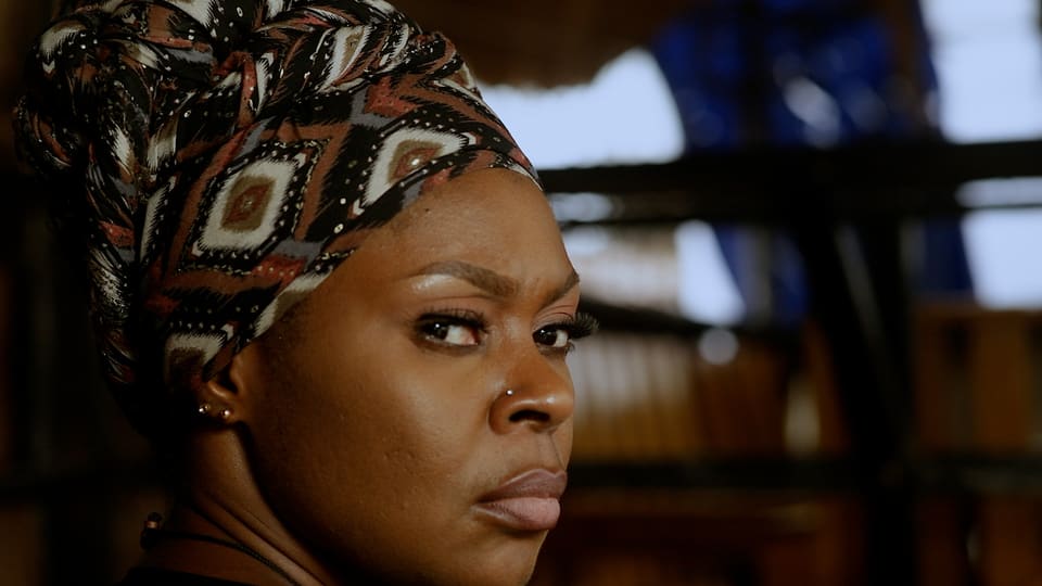 A performer in a dramatic close-up from an Itambi Studios production.