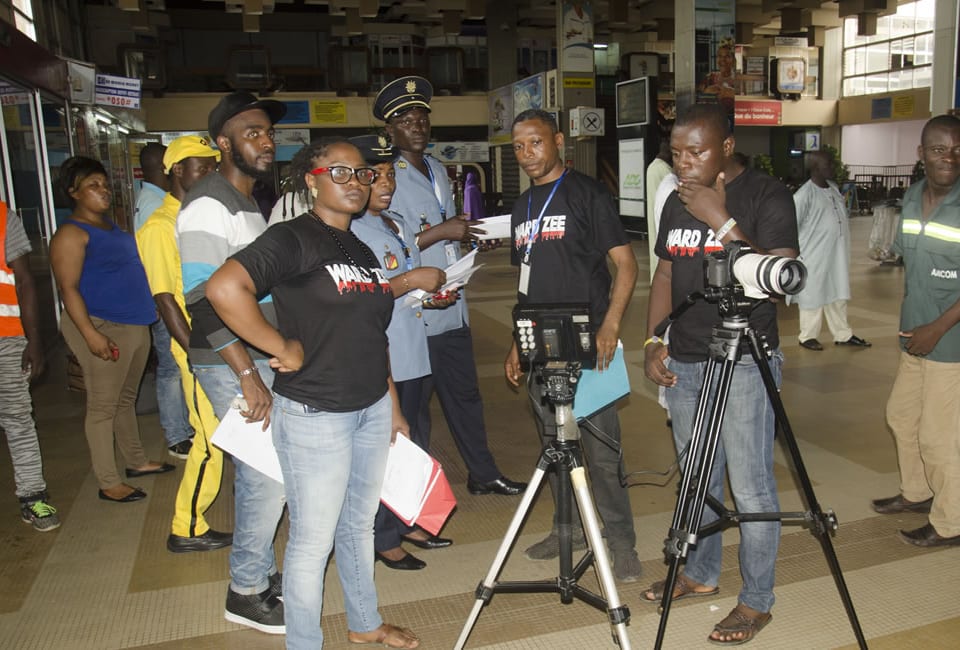 Itambi Studios crew with cameras and tripods filming on location.